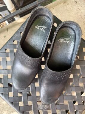 Dansko Black Leather Slip-On Mules with Perforated Detail